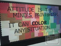 a bulletin board with words written on it and an image of a rainbow colored background