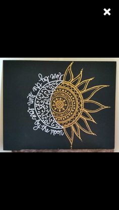 the sun and moon are drawn on a blackboard with gold foil lettering in it