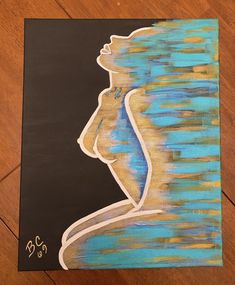 a painting of a woman's profile with blue and yellow colors on black paper