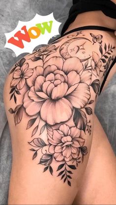 a woman's thigh with flowers on it