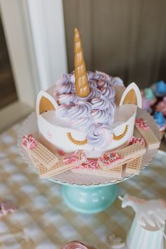 there is a unicorn cake on the table