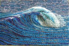 an artistic mosaic depicting a blue wave in the ocean, made from glass bottles and recycled materials