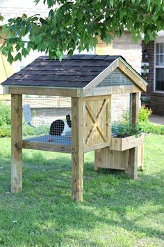 a small chicken coop in the yard