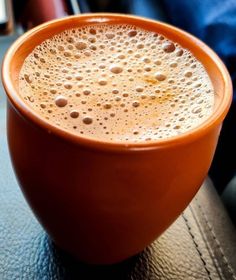 a close up of a coffee cup on a table