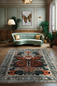 a living room filled with furniture and a rug on top of a hard wood floor