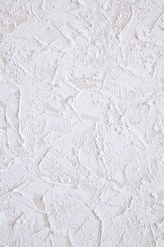 white textured wallpaper that looks like it has been painted