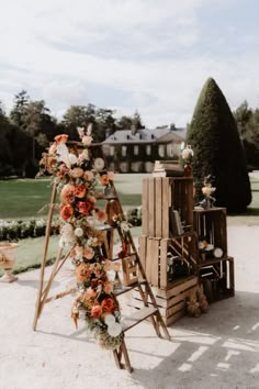 an outdoor ceremony setup with flowers and candles