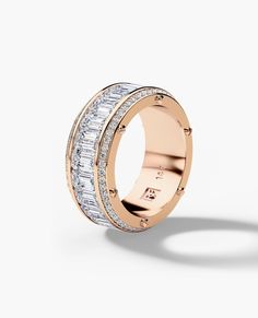 a rose gold ring with baguets and diamonds