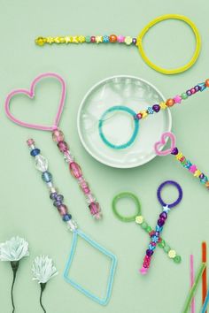 various bracelets and beads laid out on a table