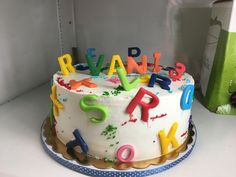 a birthday cake with letters and numbers on it