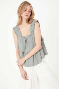 Looking for something special to wear on your next night out? Check out our Ruffled Straps with Tiered Top! This unique top features two tiers of ruffles and ruffle shoulder straps for a stylish, eye,catching look. The elastic at the shoulder straps ensures a comfortable, perfect fit. Made from gauze fabric, this top is sure to keep you cool and comfortable all night long. 2 Tier ruffles Ruffle shoulder straps Elastic at shoulder straps Gauze Hand wash cold Do not bleach Do not tumble dry Iron l Chic Cotton Tops With Ruffled Straps, Casual Green Ruffled Tank Top, Tiered Ruffle Top For Summer, Green Ruffled Tops For Summer, Cotton Tops With Ruffle Hem And Ruffled Straps, Cotton Tops With Ruffled Hem And Straps, Trendy Tops With Ruffle Hem And Ruffled Straps, Summer Tops With Ruffle Hem And Ruffled Straps, Chic Tops With Ruffled Straps And Ruffle Hem