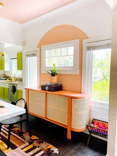 the kitchen is clean and ready for us to use it's bright green cabinets