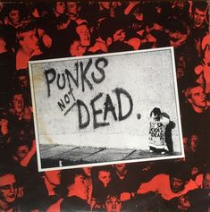 punks not dead album cover with black and red images in the background, including an image of a man holding a sign that says punks not dead