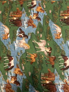 the fabric is very colorful and has horses on it