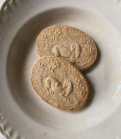 two cookies sitting on top of a white plate