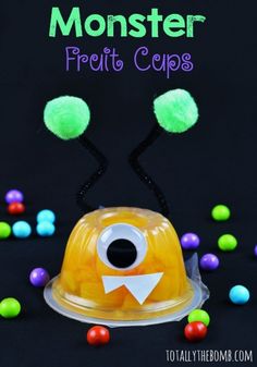 a plastic monster cup with pom - poms around it and the words monster pretti cups above it