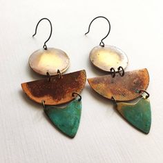 Inspired by the colors of Sedona, these earrings are made with oxidized metals using our verdigris green patina and our unique and original organic patina which creates orange and red on copper and brass.  Earrings are 3.5" long and hang from oxidized sterling silver ear wires.ssd jewelry © 2017Please not that the patina process is an organic process and shades of color will vary.  All of our items are HANDMADE and made to order and may take up to approx. 2 weeks to fabricate (not including ship Unique Multicolor Patina Jewelry, Unique Multicolor Jewelry With Patina, Artistic Copper Earrings With Patina, Bohemian Brass Earrings In Rust Color, Handmade Vintage Rust-colored Earrings, Bohemian Rust Brass Earrings, Handmade Vintage Rust Earrings, Handmade Rust Vintage Earrings, Vintage Copper Earrings With Patina