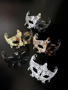 Each mask features an exquisite blend of metalwork and shimmering crystals, displaying artistry and elegance. The patterns and details of these masks in rose gold, black, gold, and silver hues make them perfect for any grand event, from masquerade balls to sophisticated parties. Age Group/Gender - Adult/Women Size/Type - One size fits all adults Color - Rose Gold/Silver/Gold/Black/White Material - Laser cut metal Special Features - Crystals Elegant Black Formal Mask, Elegant Silver Eye Mask, Elegant Silver Masks And Prosthetics For Party, Elegant Black Party Masks And Prosthetics, Elegant Black Masks And Prosthetics For Party, Elegant Silver Masquerade Mask For Costume Party, Elegant Masquerade Mask For Festivals, Elegant Silver Evening Masks, Elegant Silver Masquerade Mask