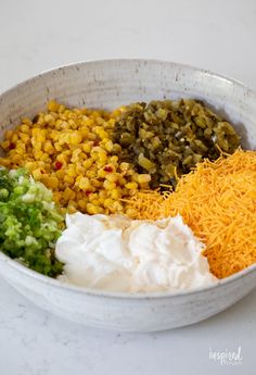 a white bowl filled with different types of food