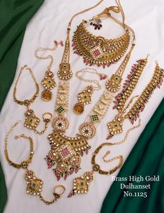 an assortment of gold necklaces and bracelets