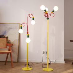 two lamps are standing next to each other on the floor