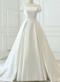 a white wedding dress on a mannequin