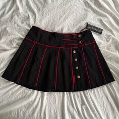 Cute Tripp Nyc X Dolls Kill Pleated Skirt In The Colors Black And Red. It Consists Of A High Waist Fit, Contrast Color Stitching, A Pleated Design, And Button Detailing. Made Of 97% Cotton, 3% Spandex. Size: Women’s S. Brand New, Unworn, With Original Tag. Product Is No Longer Available In The Official Dolls Kill Website. Retro Black Mini Skirt With Lining, Retro Black Flared Skirt, Lip Service Clothing Vintage, Red And Black Clothes Aesthetic, Purple And Red Outfit, Red And Black Clothes, Red Pleated Skirt Outfit, Red And Black Fits, Red And Black Skirt