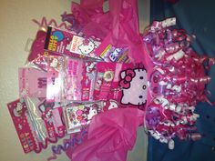 a hello kitty birthday gift basket filled with candy