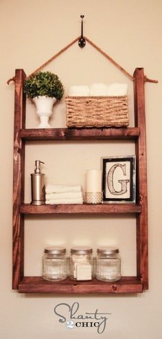 a wooden shelf above a toilet in a bathroom