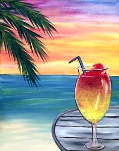 a painting of a drink sitting on top of a wooden table next to the ocean