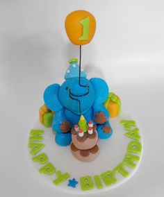 an elephant birthday cake with the number one on it's top and candles in the middle