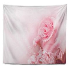 a pink wall hanging with flowers on it