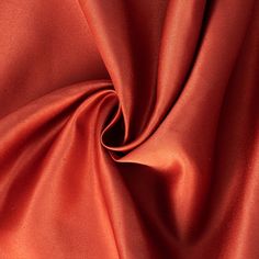 an orange satin fabric with very thin folds