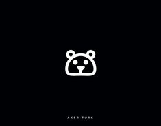 a black and white logo with a bear's head in the center, on a dark background