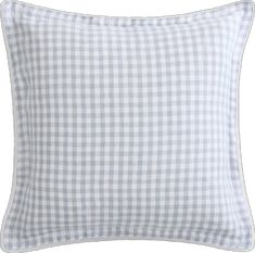 the gingham checkered pillow in blue and white is shown on a white background