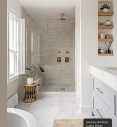 a bathroom with white walls and marble floors