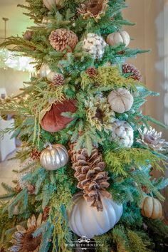 a christmas tree decorated with pine cones and ornaments