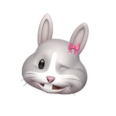 a white rabbit with pink bows on its head