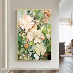 a painting on the wall in a living room with white walls and wood flooring