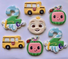 there are many decorated cookies in the shape of cars