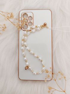 Hello 🌸😊 As two sisters, we produce beautiful products for you with all our love. We add our love for you and your loved ones to all our products.  We decorated our phones, which have a big place in our lives, with pearls. We made the pearl phone hanger. In addition, this phone strap made of real water pearls will be a nice gift option for you and your loved ones. You can choose our jewelry as a birthday, Valentine's day, mother's day, anniversary gift, graduation souvenir and many other gifts Graduation Souvenirs, Phone Hanger, Gold Phone, Beaded Designs, Phone Chain, Phone Strap, Gift Graduation, Two Sisters, Water Pearls