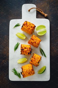 grilled corn on the cob with lime wedges