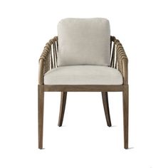 an upholstered chair with a white cushion