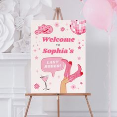 a welcome sign is displayed on an easel