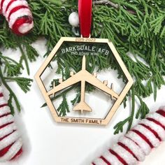 a christmas ornament with an airplane on it