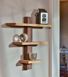 three wooden shelves with various items on them