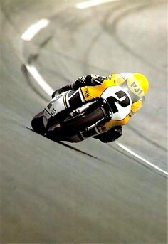 a person riding a motorcycle on a race track