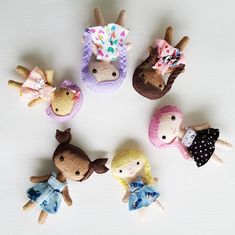 five little dolls are arranged in a circle