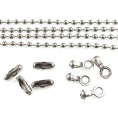 several metal objects are arranged on a white surface, including beads and clasps to make the chain look like it has been cut in half