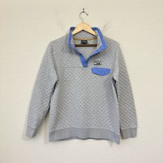 Patagonia Womens Quilt Snap-T Pullover Sweater Grey Blue Organic Cotton M Rare W6492 Overall In Great Pre-Loved Condition. Minor Tiny Rip On Right Back Sleeve And A Minor Loose Thread On Left Sleeve. These Minor Defects Are Hardly Noticeable When Worn And Add Additional Distress Character To The Already Vintge Look Pullover Sweater. See All Pictures For Detail. Size - M Color - Grey / Baby Blue Material - 72% Organic Cotton, 28% Polyester Style - Pullover Type - Sweater Neckline - Mock Neck Sleeve Length - Long Sleeve Theme - Outdoor, Preppy Features - Insulated, Lightweight, Pocket Pattern - Argyle / Diamond Accents - Button, Logo, Quilted Fit - Regular Button Logo, Patagonia Sweater, Grey Baby, Sweater Grey, Pocket Pattern, Patagonia Womens, Grey Blue, Grey Sweater, Pullover Sweater